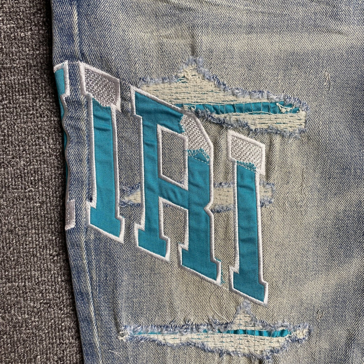 AMIRI VARSITY LOGO JEANS