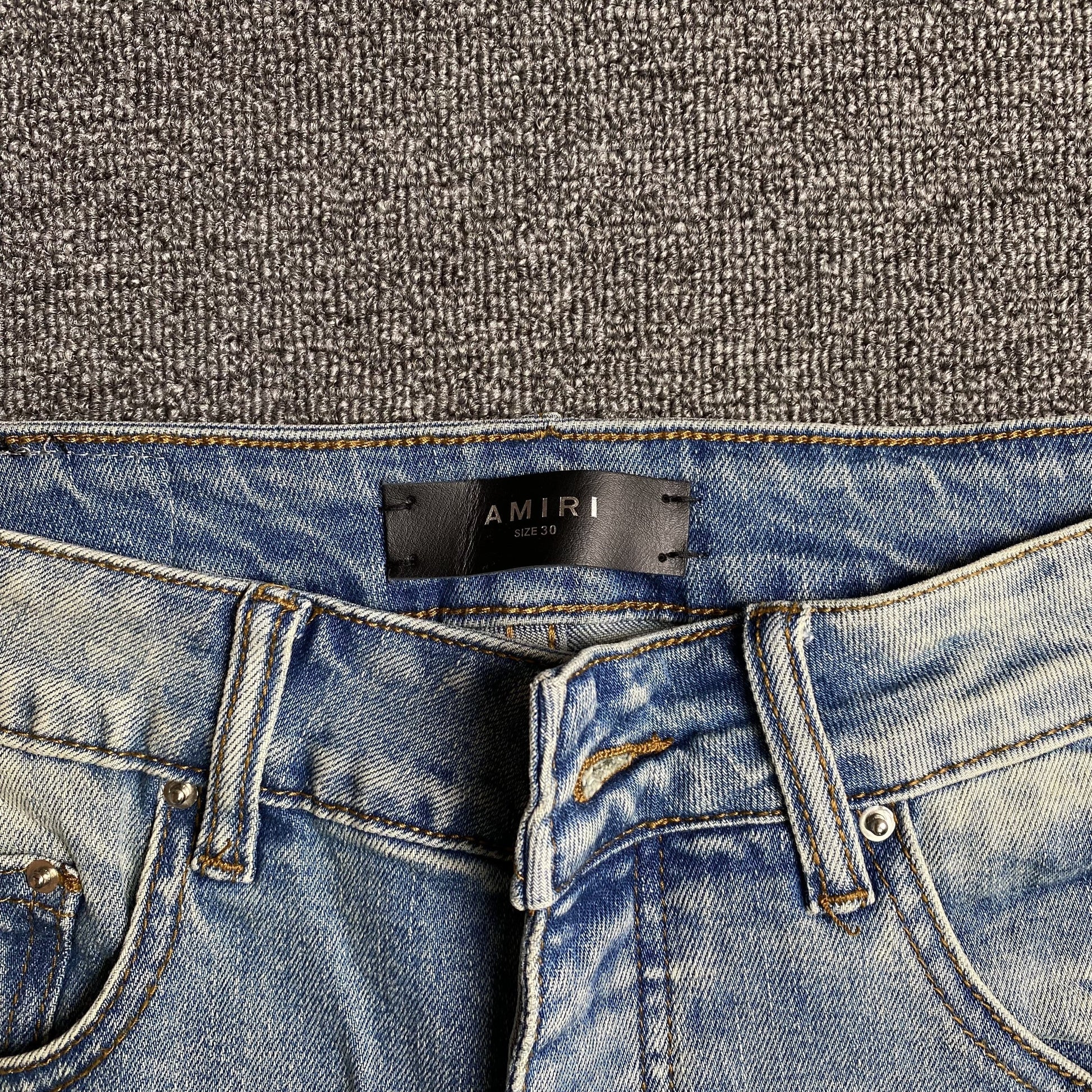 AMIRI VARSITY LOGO JEANS