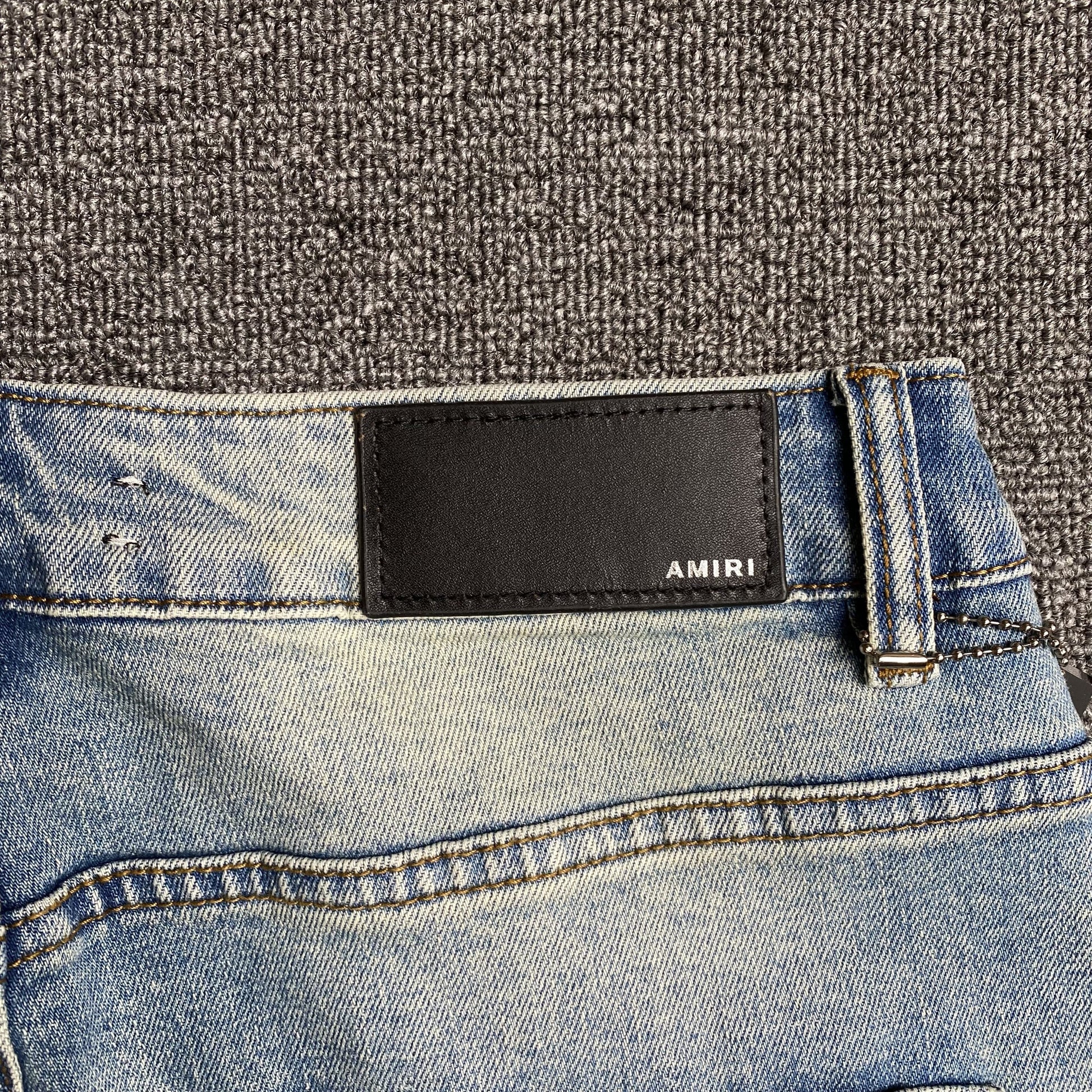 AMIRI VARSITY LOGO JEANS