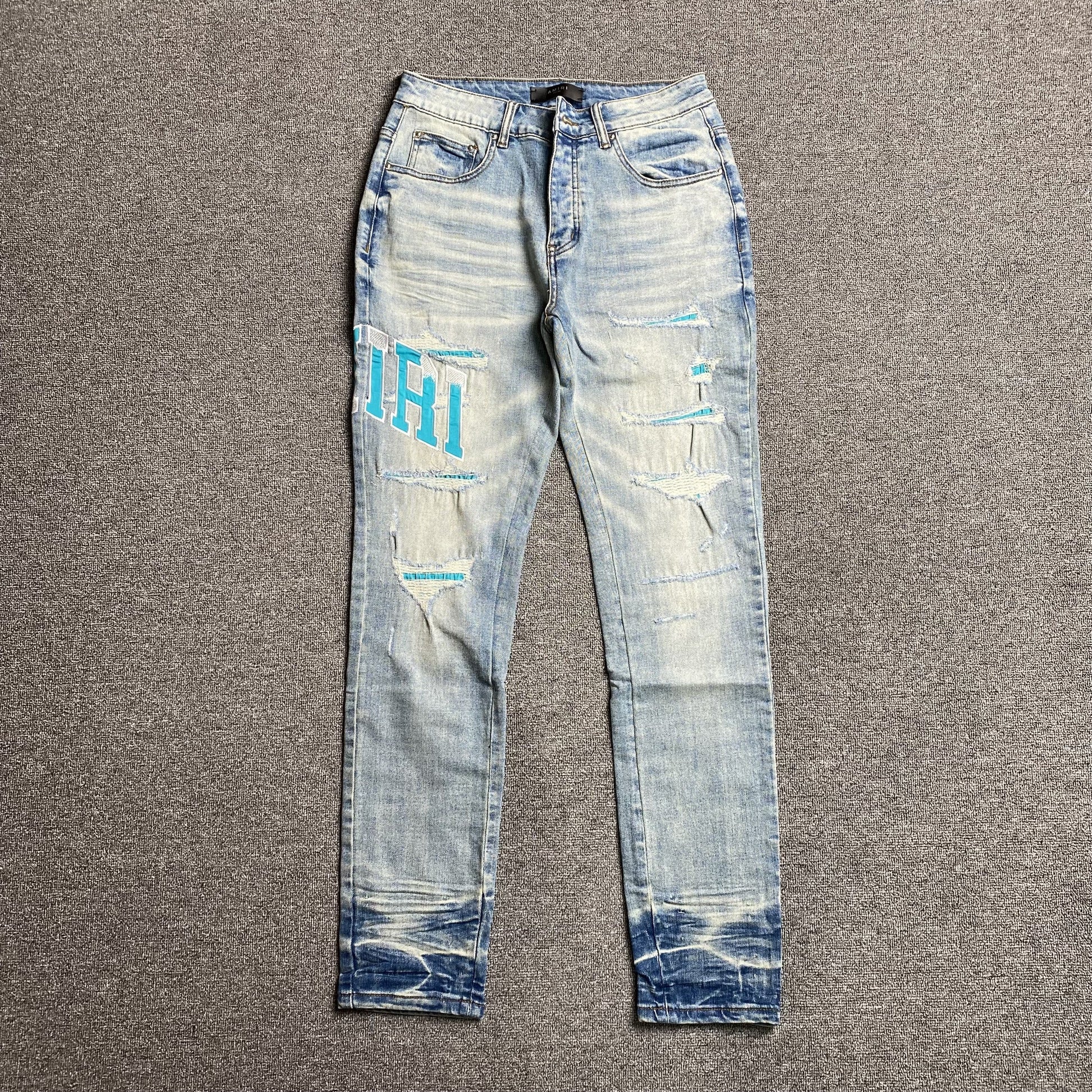 AMIRI VARSITY LOGO JEANS