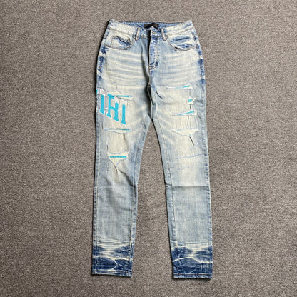 AMIRI VARSITY LOGO JEANS