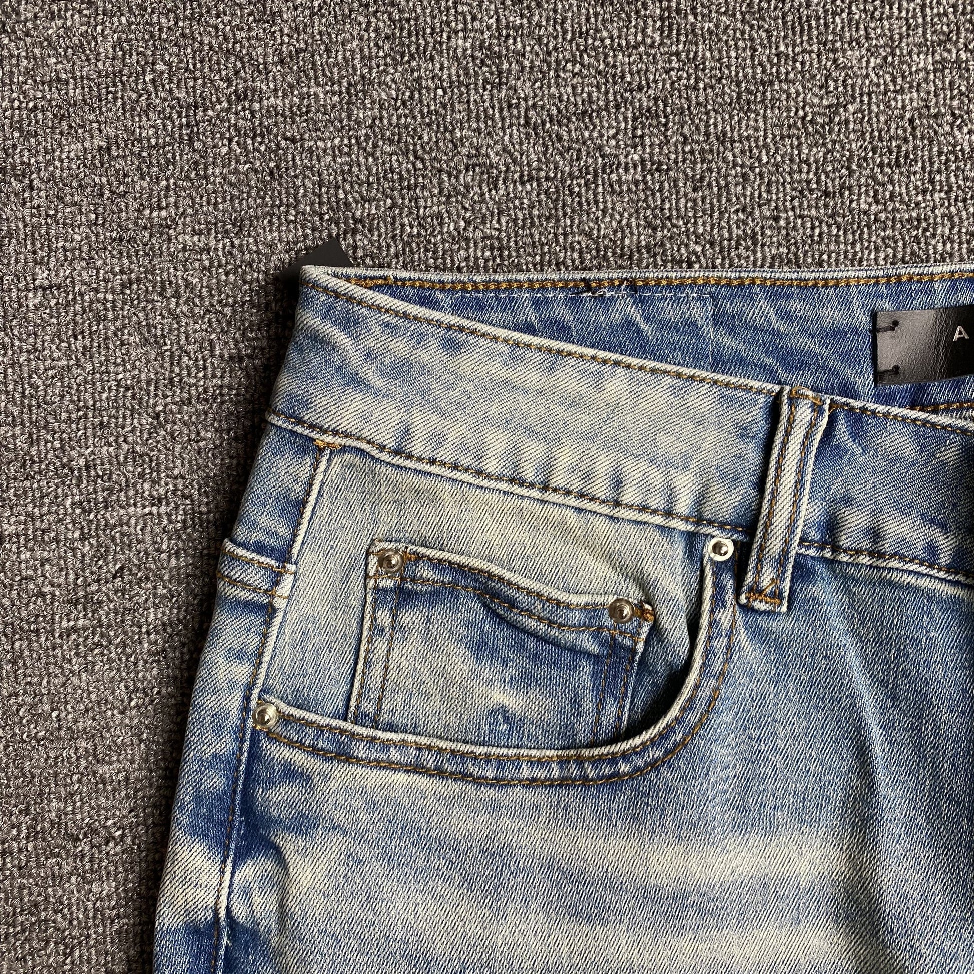 AMIRI VARSITY LOGO JEANS