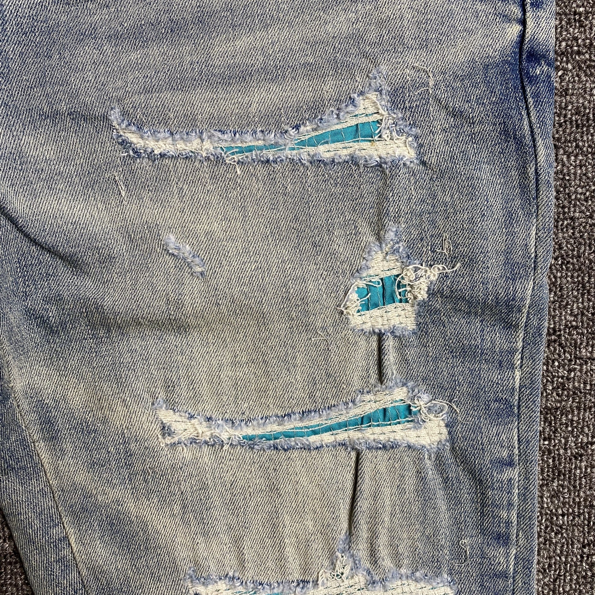 AMIRI VARSITY LOGO JEANS