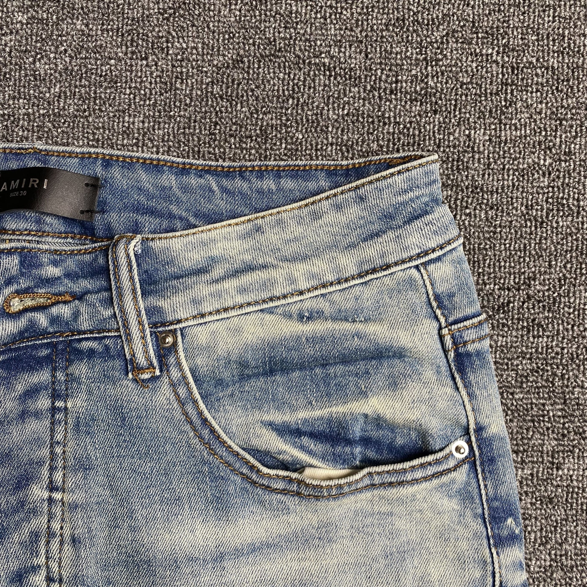 AMIRI VARSITY LOGO JEANS