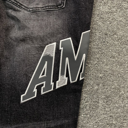 AMIRI VARSITY LOGO REPAIR JEANS